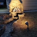 A stone nativity grotto with lighting