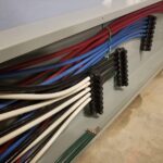 Electrical wires neatly organized on the wall