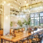 A big dining area with lots of hanging lights