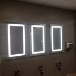 Three bathroom mirrors with lighting